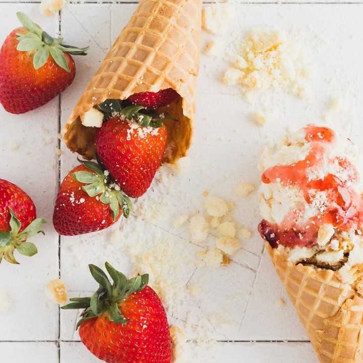 Image of strawberry ice cream in a cone