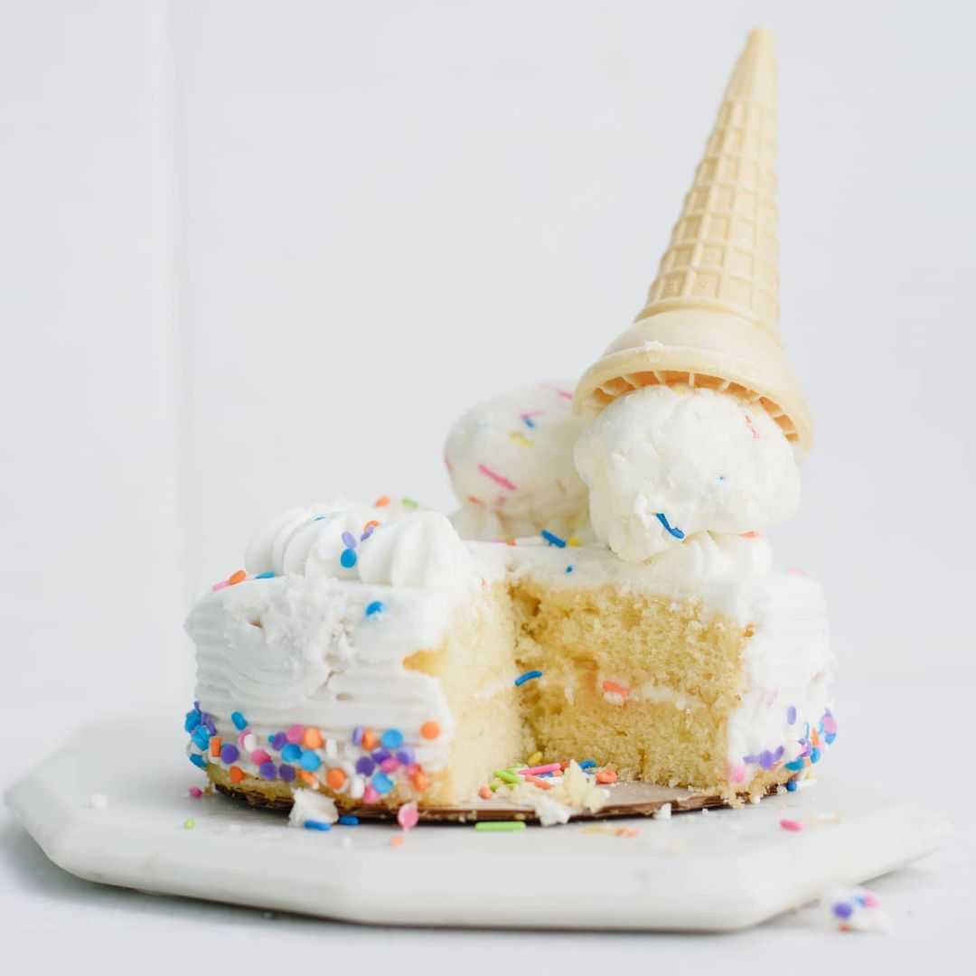 a scoop of birthday cake ice cream on a cake